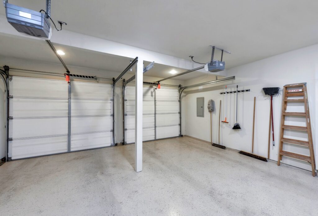 clean garage with brooms